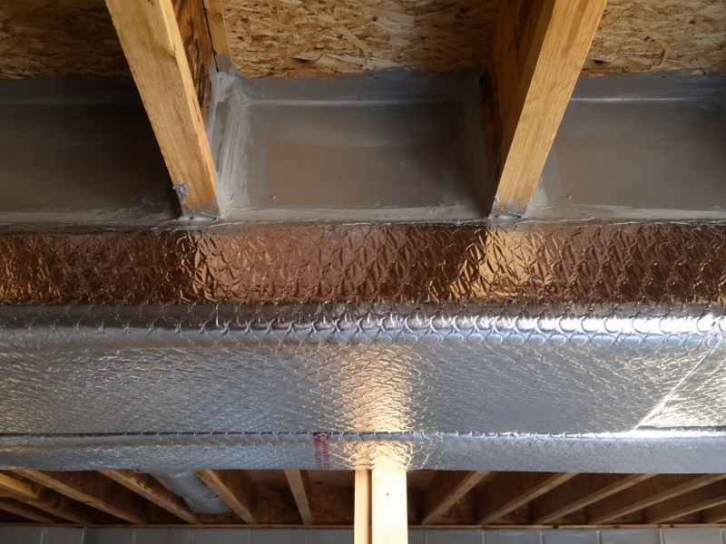 An air duct leak in a basement that has been repaired by Fitch Services in Charlottesville, Virginia.